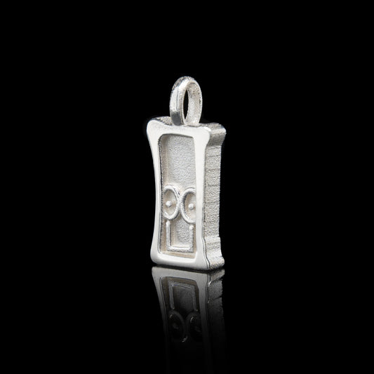 Everyman sterling silver smile head charm pendant with a unique design on a black background